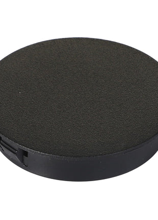 The AGCO | PLUG - AG562388 is a black plastic grommet cable cover featuring a round, flat surface and a small slot for cable passage. No current product description information available.