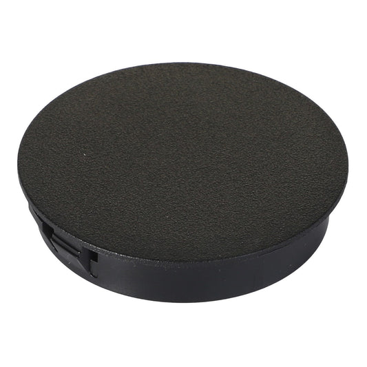 The AGCO | PLUG - AG562388 is a black plastic grommet cable cover featuring a round, flat surface and a small slot for cable passage. No current product description information available.