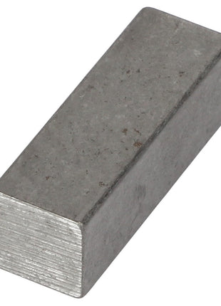 The AGCO | KEY - AG714891 is a rectangular metallic block with a dull, rough surface and visible texture on the ends.