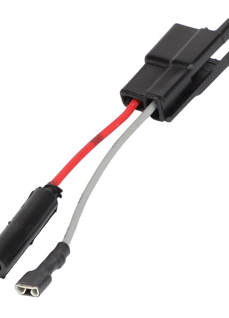 The AGCO wire harness - AG610514 is a black and red cable adapter with a sleek black cylindrical component, a black plastic connector, and two wires: one red and one white.