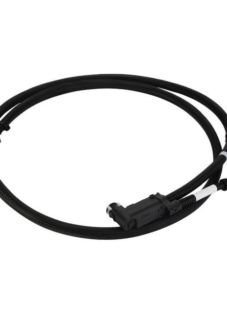 The AGCO Fuel Hose - Acw2822680 is a coiled black cable with connectors at each end, ideal for versatile electronic or automotive applications.