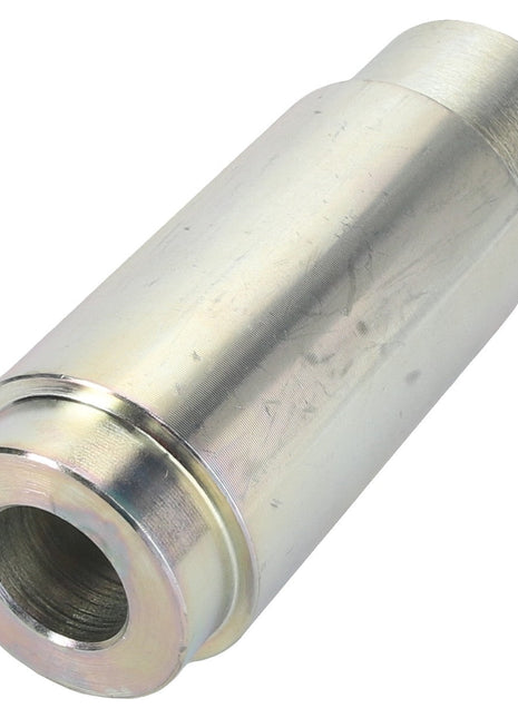 A close-up view of the AGCO | Spacer - Acw0942560, a cylindrical metal object featuring a hollow center, likely a precision-engineered mechanical part or fitting.