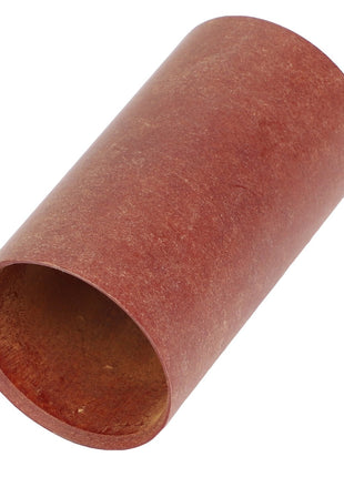 A cylindrical, reddish-brown cardboard tube labeled as AGCO | SLEEVE - AG703965 lies on a white background at a slight angle, displaying its hollow interior on one end.